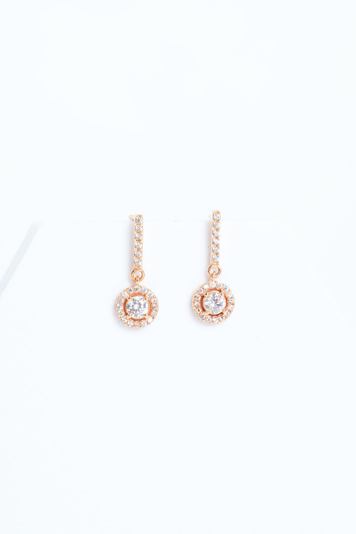 WHITE CRYSTALS FROM SWAROVSKI STUDDED,ROSE GOLD FINISH EARRINGS